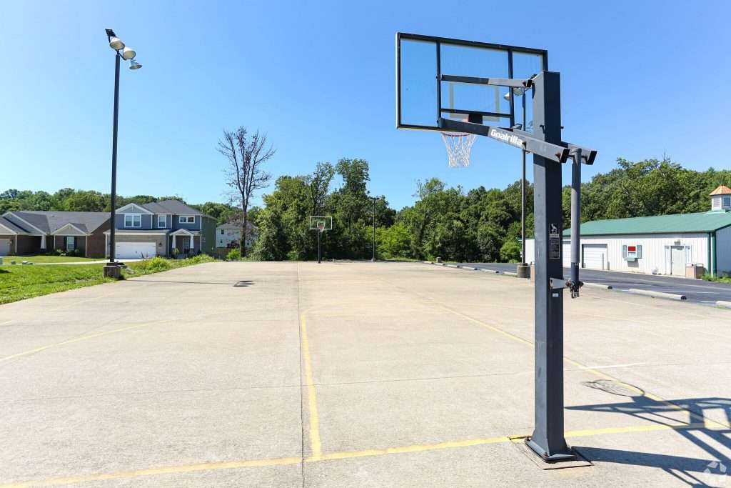 a basketball hoop in a parking lot