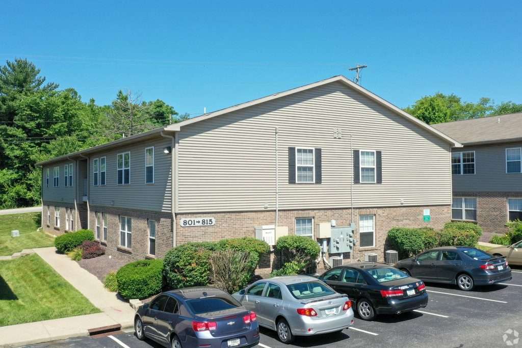 a building with cars parked in front of it