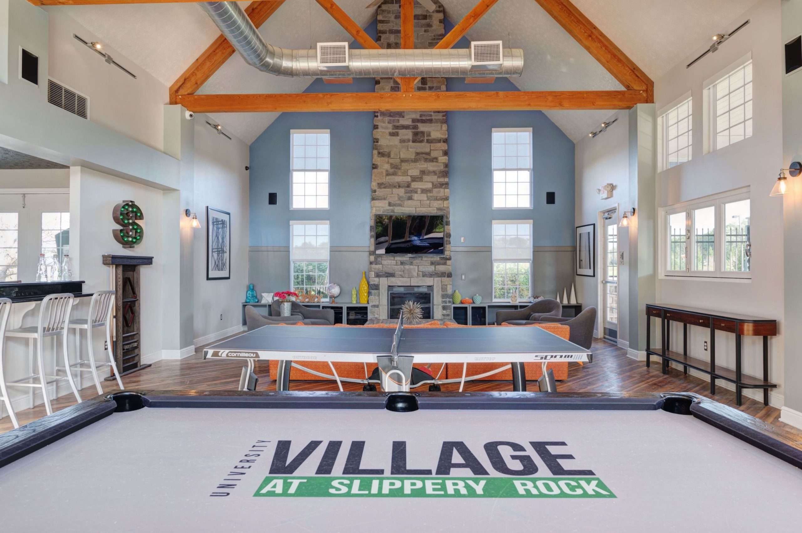 a room with a pool table and a fireplace