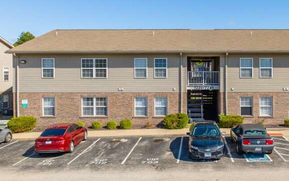 a building with cars parked in front of it