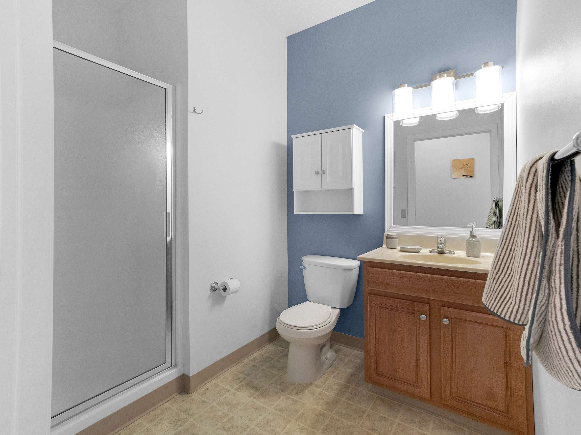 a bathroom with a shower and toilet