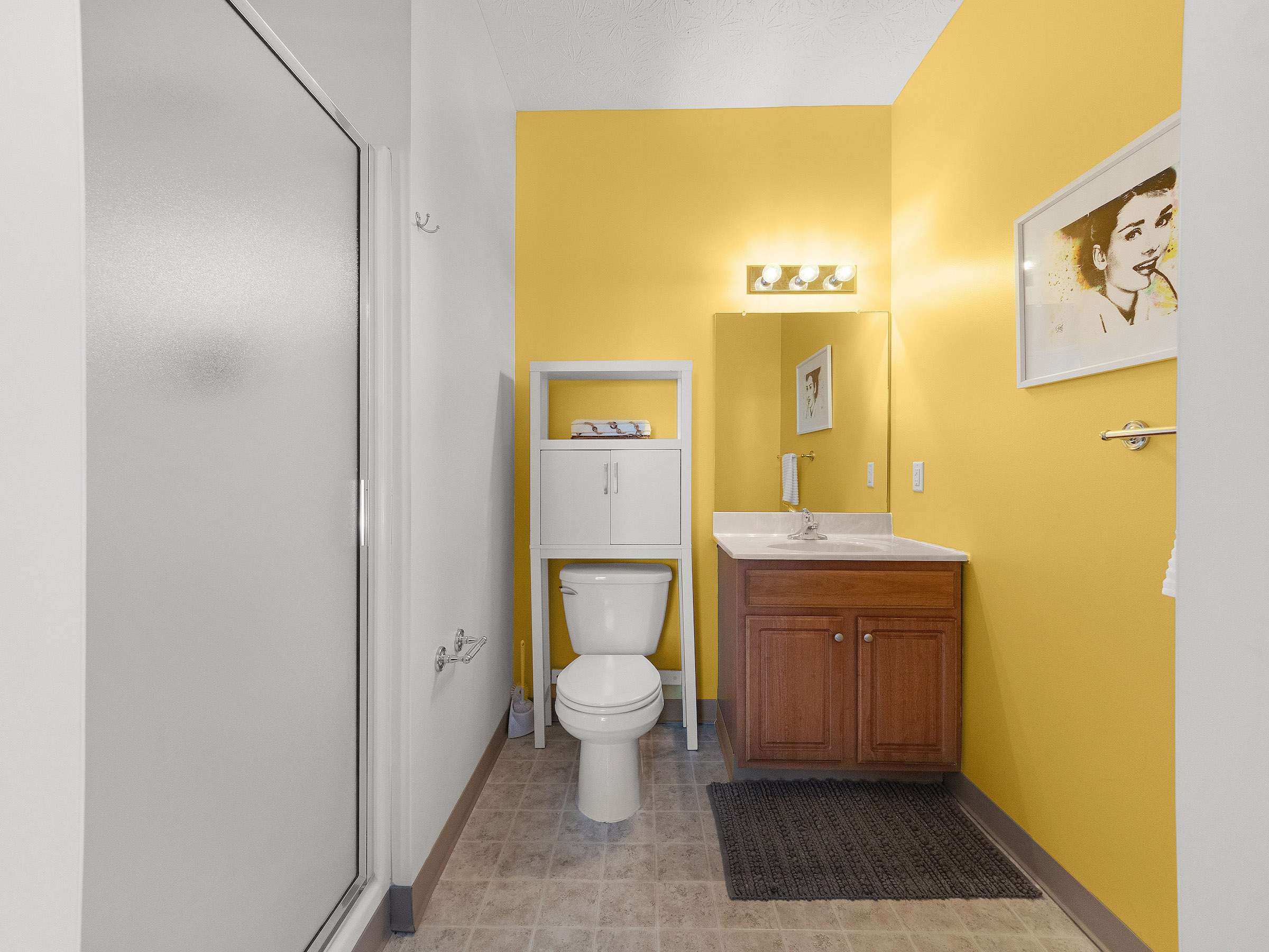 a bathroom with yellow walls and a toilet