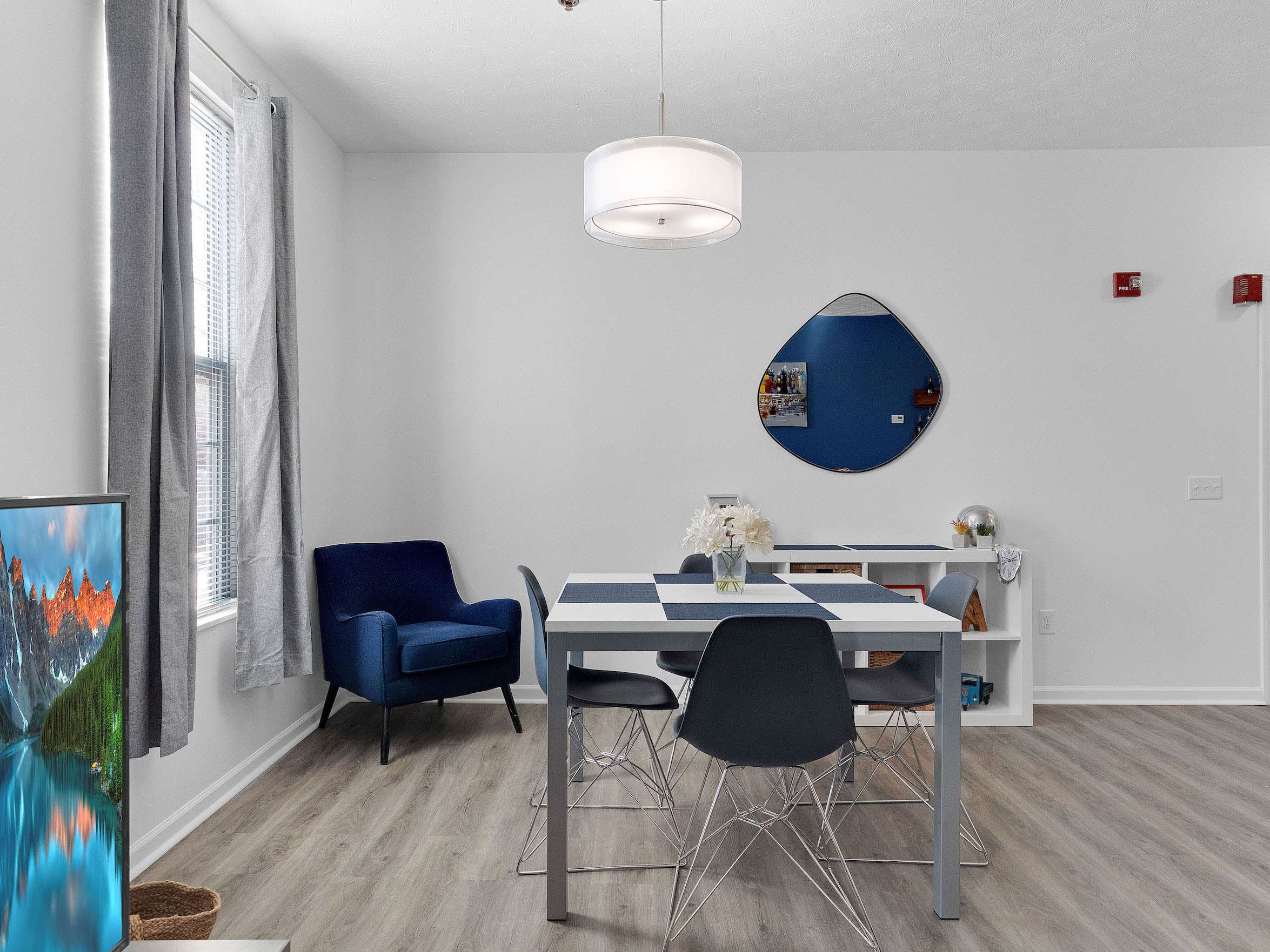 a room with a table and chairs