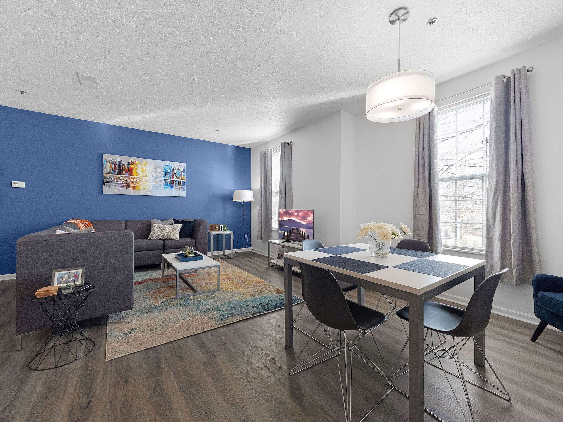 a living room with a table and chairs