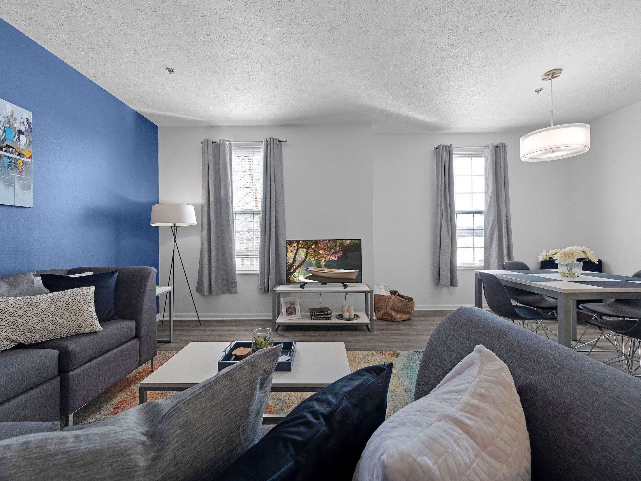 a living room with blue walls and a blue wall