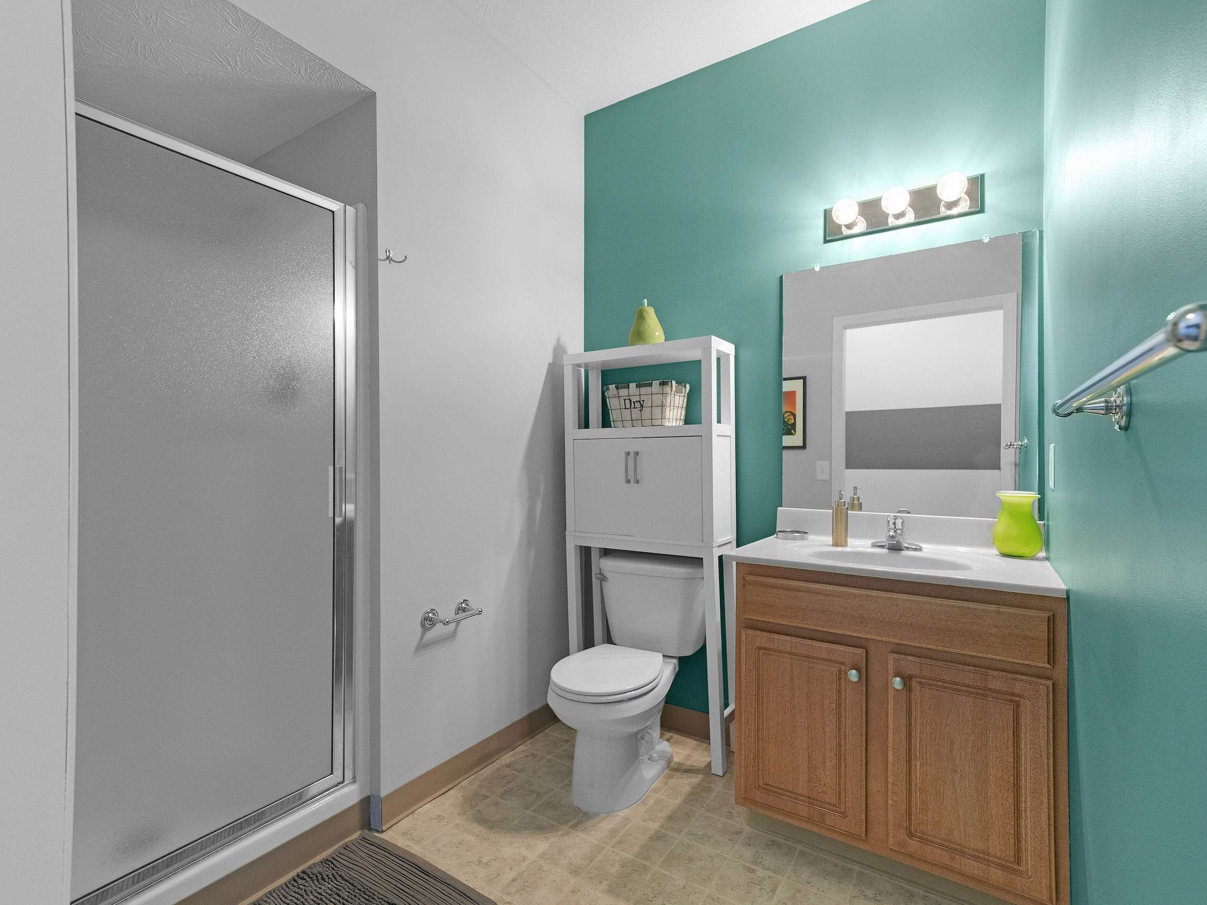 a bathroom with a shower and toilet