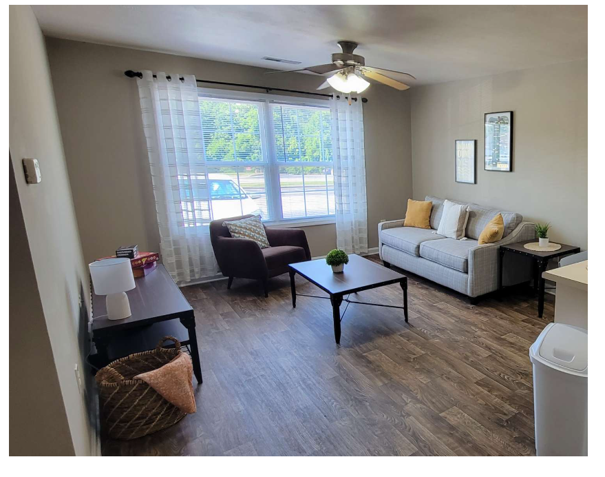 a living room with a couch and a table