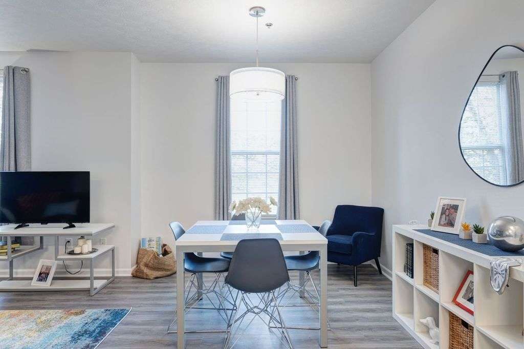 a room with a table and chairs